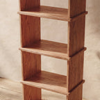 Tall narrow bookcase in red oak