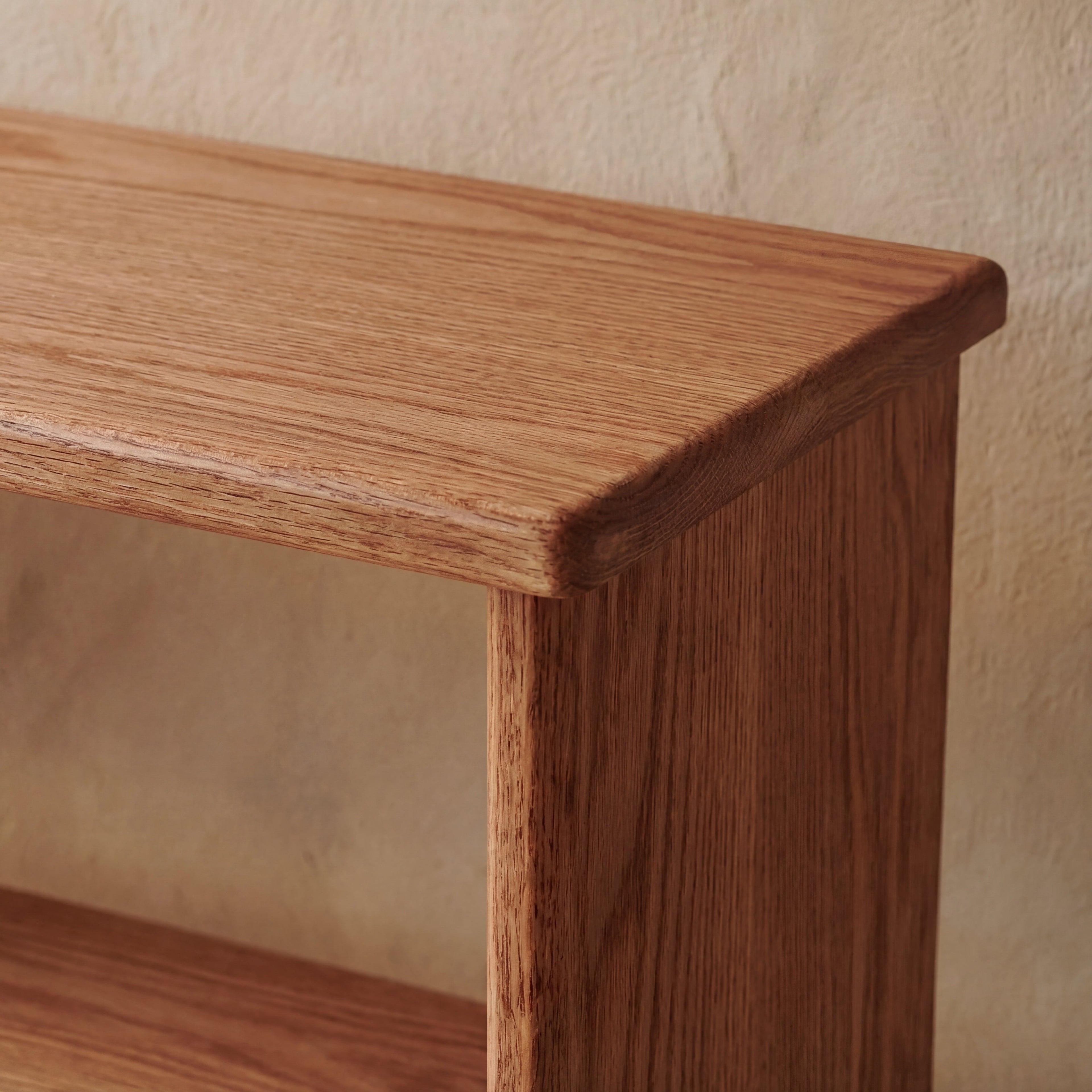 Tall narrow bookcase in red oak